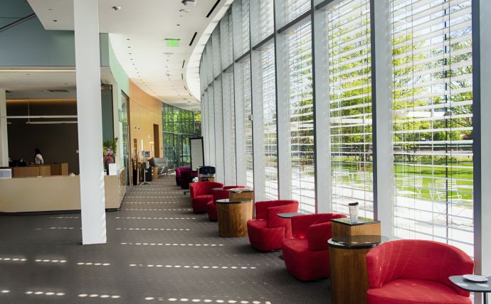 Red Sofa Chairs Beside Glass Wall Inside Building